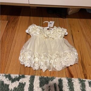 Elegant Cream Baby Dress with Floral Details